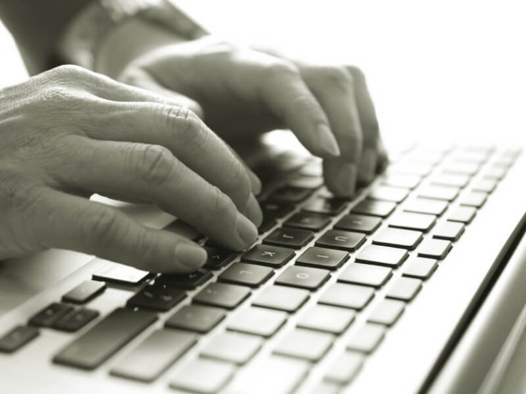 typing on laptop