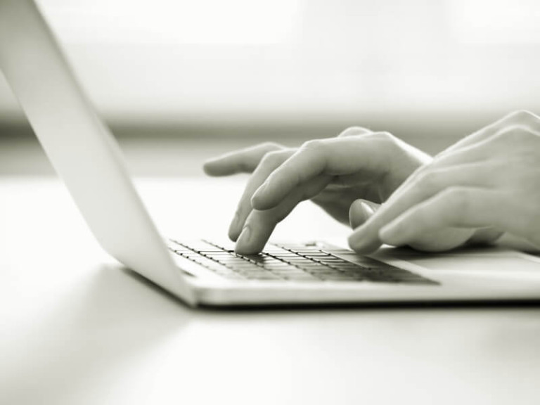 typing on a laptop